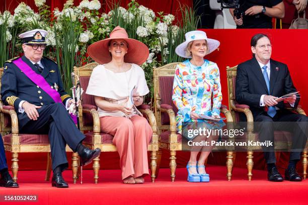 Prince Laurent of Belgium, Princess Claire of Belgium, Princess Delphine of Belgium and Jim OHare attend the military parade at the palace square on...