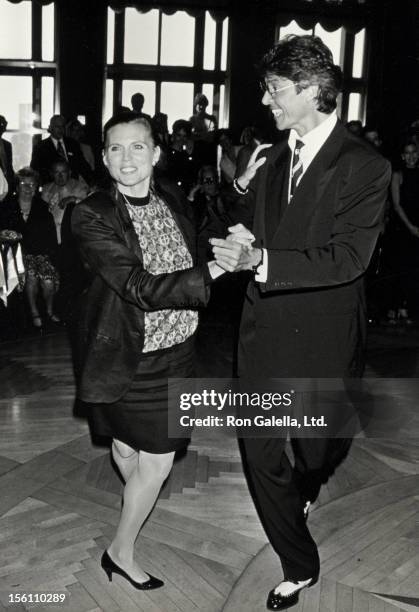 Actress Ann Reinking and actor Tommy Tune attending the opening of 'Ballroom Week '90' on May 31, 1990 at the Rainbow Room in New York City, New York.