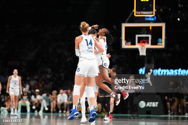 Tiffany Mitchell of the Minnesota Lynx celebrates a three point basket entering halftime of the game against the New York Liberty on July 28, 2023 at...