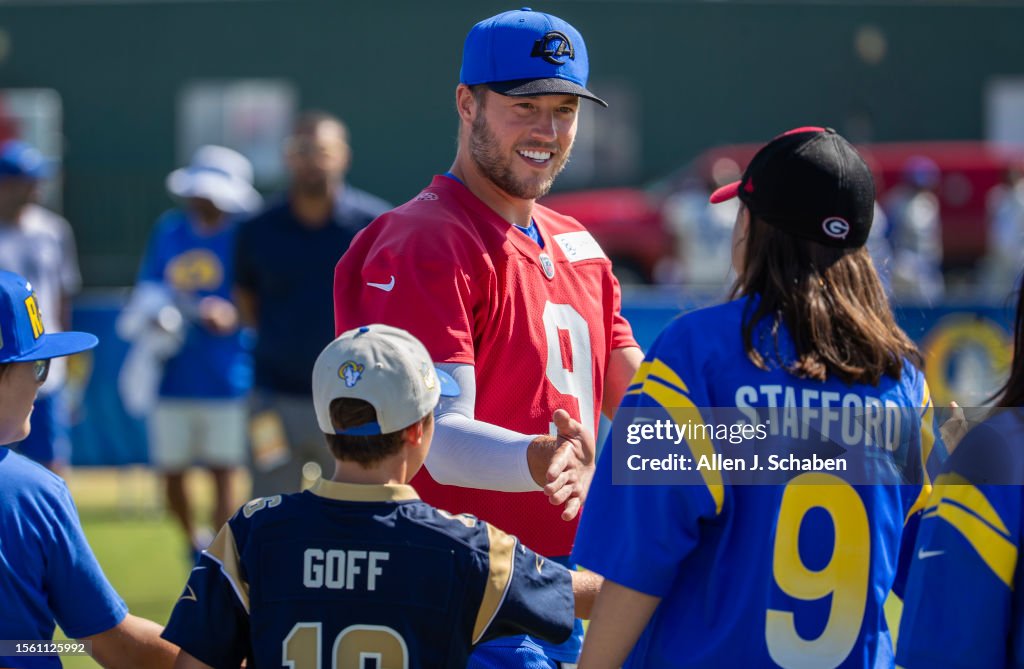 Rams quarterback Matthew Stafford greets fans as he arrives at Rams