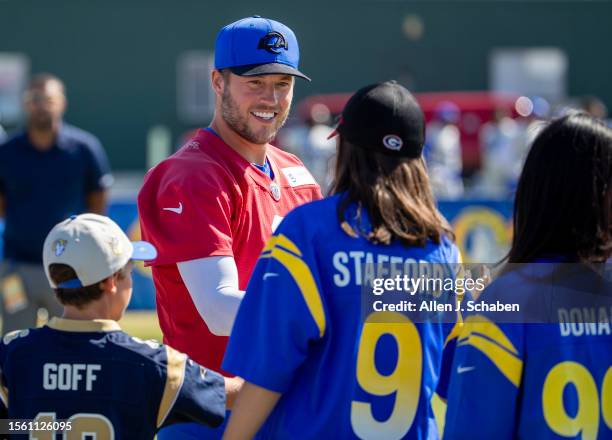 Rams quarterback Matthew Stafford greets fans as he arrives at Rams training camp at UCI in Irvine Thursday, July 27, 2023.