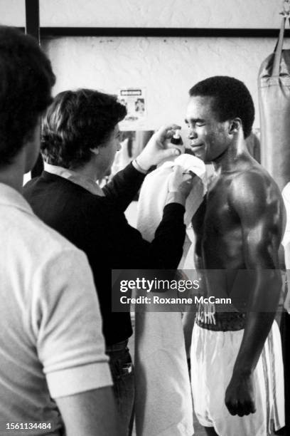 Champion professional boxer Sugar Ray Leonard is sprayed to appear covered in perspiration for a 7 Up commercial at a boxing ring in 1980 in Los...