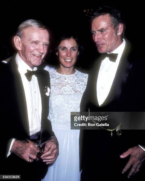 Actor Fred Astaire and wife Robyn Smith and Actor Charlton Heston attend the Ninth Annual American Film Institute Lifetime Achievement Award Salute...