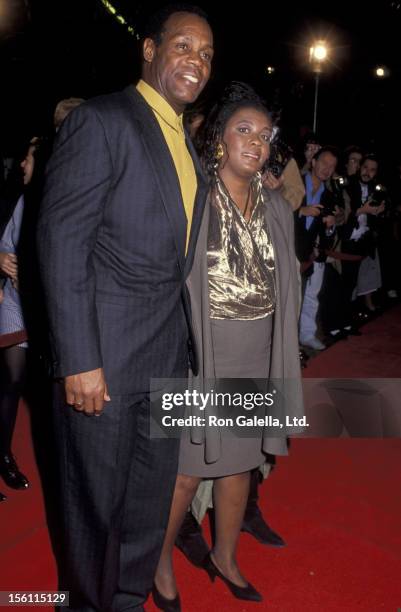 Actor Danny Glover and wife Asake Bomani attending the premiere of 'Predator 2' on November 19, 1990 at Westwood Avco Theater in Westwood, California.
