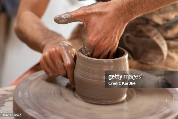 ceramists working with clay on a rustic lathe, artisanal work with clay, handcrafted ceramics from brazil - vaso de barro stock pictures, royalty-free photos & images