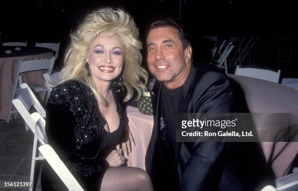 Musician Dolly Parton and Hollywood Manager/Producer Sandy Gallin attend the Party to Celebrate Kelly Klein's New Book 'Pools' on November 19, 1992...