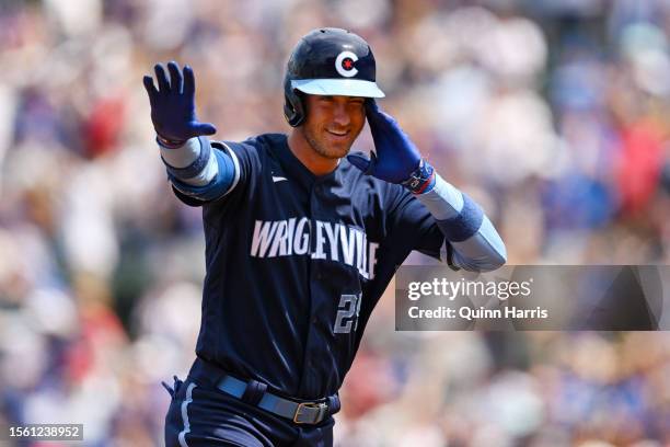 Cody Bellinger of the Chicago Cubs celebrates after a two-run home run in the third inning against Jack Flaherty of the St. Louis Cardinals at...