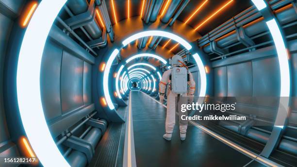 astronaut stands in a tunnel with neon lights ready for a journey - come & get it stock pictures, royalty-free photos & images