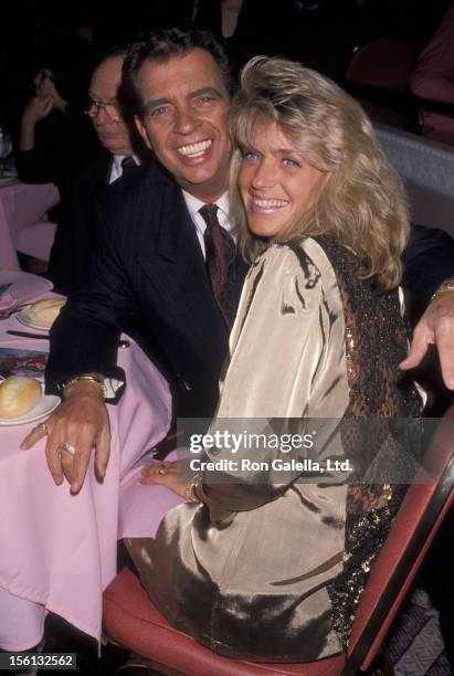 Talk Show Host Morton Downey Jr. And actress Lori Krebs attending 'Grand Opening of Blue Angel Club' on April 30, 1990 in New York City, New York.