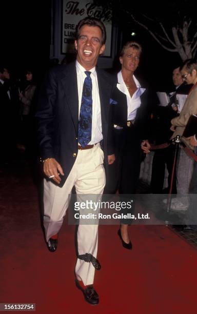 Talk Show Host Morton Downey Jr. And actress Lori Krebs attending the premiere of 'Predator 2' on November 19, 1990 at the Westwood Avco Theater in...