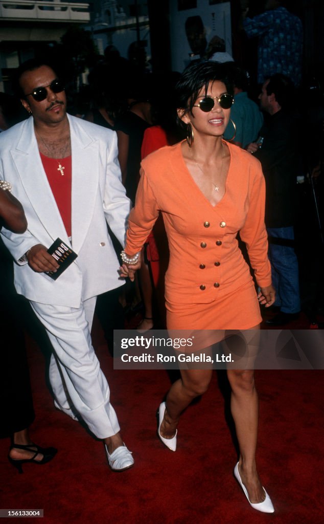 Actress Nia Peeples and singer Howard Hewett attending the premiere