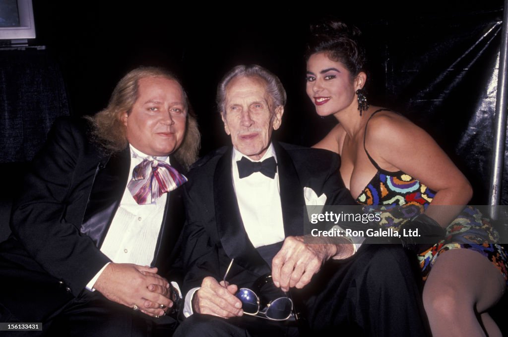 Comic Sam Kinison, wife Malika Souiri and actor Vincent Price attend