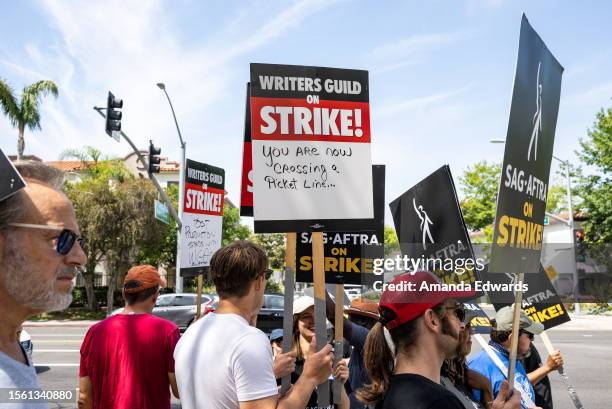 Members and supporters of SAG-AFTRA and WGA walk the picket line at Sony Pictures Studios on July 21, 2023 in Culver City, California. Members of...