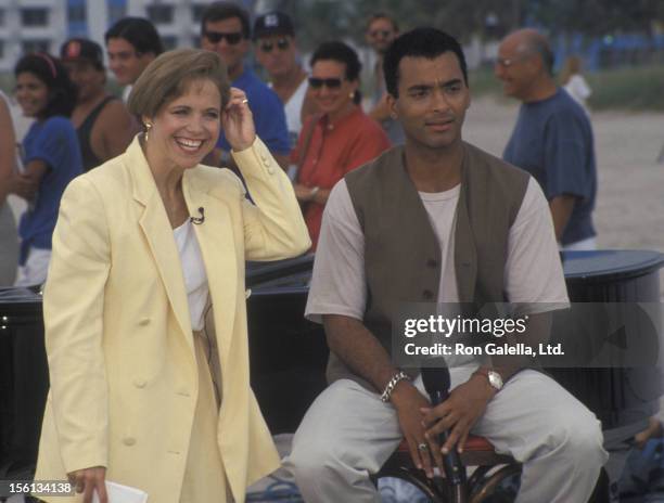 Singer Jon Secada and journalist Katie Couric attending the taping of 'The Today Show' on May 19, 1994 in Miami, Florida.