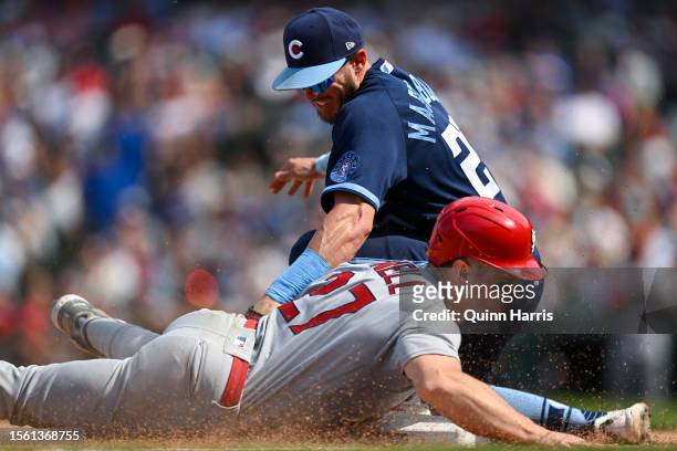 Tyler O'Neill of the St. Louis Cardinals steals third base in the eighth inning against Miles Mastrobuoni of the Chicago Cubs at Wrigley Field on...