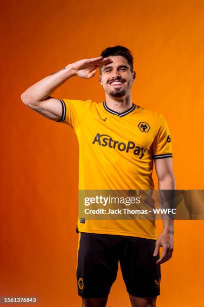 Pedro Neto of Wolverhampton Wanderers poses for a portrait in the Wolverhampton Wanderers 2023/2024 Home Kit at The Sir Jack Hayward Training Ground...