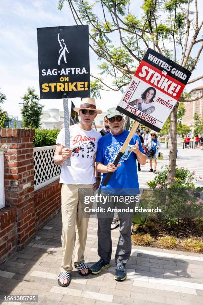 Actor Timothy Olyphant and writer Victor Fresco join members and supporters of SAG-AFTRA and WGA on the picket line at Amazon Studios on July 21,...