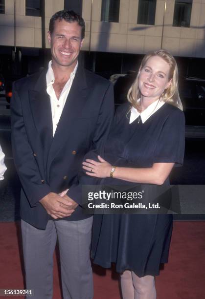 Actor Brad Johnson and wife Laurie Johnson attend the Screening of the TNT Original Movie 'Rough Riders' on July 17, 1997 at Academy Theatre in...
