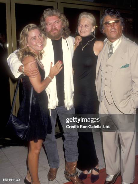 Writer Joe Eszterhas and date Naomi Baca and Producer Robert Evans and guest Christine Hoffman attend the 'Sliver' Westwood Premiere on May 19, 1993...