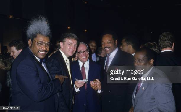 Fight Promoter Don King, businessmen Donald Trump and Malcolm Forbes, Jesse Jackson and John H. Johnson attend Mike Tyson vs. Michael Spinks Boxing...