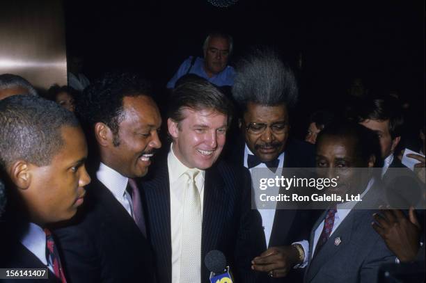 Jesse Jackson, businessman Donald Trump, Fight Promoter Don King and John H. Johnson attend Mike Tyson vs. Michael Spinks Boxing Match on June 27,...