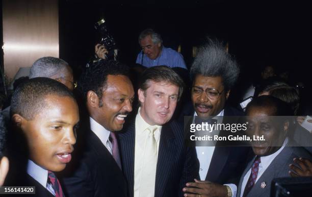 Jesse Jackson, businessman Donald Trump, Fight Promoter Don King and John H. Johnson attend Mike Tyson vs. Michael Spinks Boxing Match on June 27,...