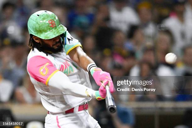 Fernando Tatis Jr. #23 of the San Diego Padres hits a solo home run during the fifth inning against the Texas Rangers at Petco Park on July 28, 2023...