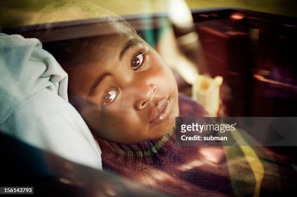portrait of young boy in car - tuberculosis bacterium stock pictures, royalty-free photos & images