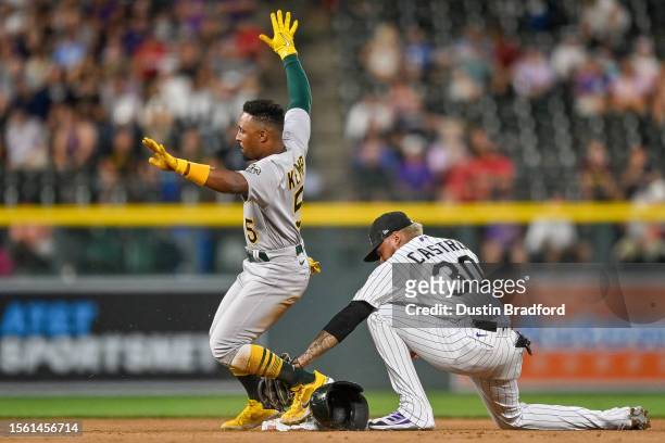Tony Kemp of the Oakland Athletics celebrates as he reaches second base with a double in the eighth inning, as Harold Castro of the Colorado Rockies...