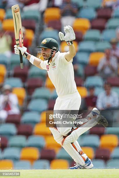 Ed Cowan of Australia celebrates his century during day four of the First Test match between Australia and South Africa at The Gabba on November 12,...