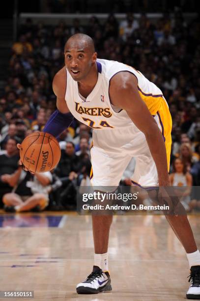 Kobe Bryant of the Los Angeles Lakers dribbles in a game against the Sacramento Kings at Staples Center on November 11, 2012 in Los Angeles,...