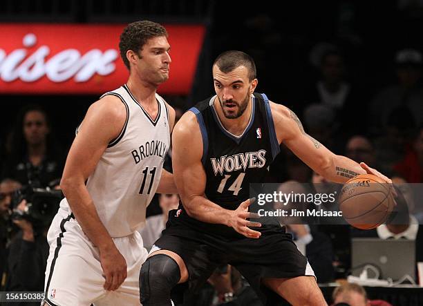 Nikola Pekovic of the Minnesota Timberwolves in action against Brook Lopez of the Brooklyn Nets at the Barclays Center on November 5, 2012 in the...