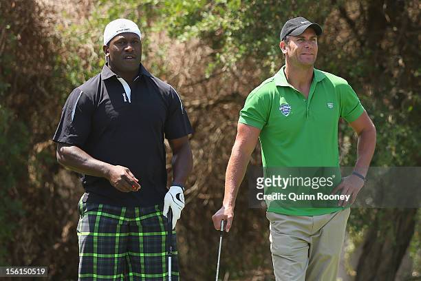 Wendell Sailor and Wayne Carey look on during the Melbourne Golf Invitational Pro-Am at Woodlands Golf Club on November 12, 2012 in Melbourne,...