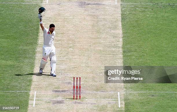 Ed Cowan of Australia celebrates after reaching maiden test century during day four of the First Test match between Australia and South Africa at The...