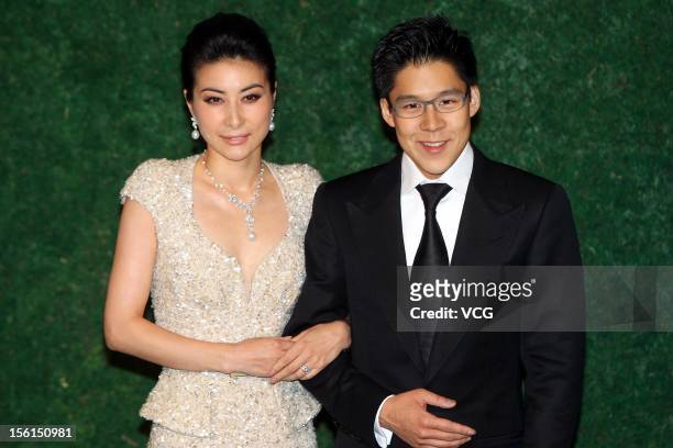 Retired four-time Olympic diving champion Guo Jingjing and Kenneth Fok Kai-kong, the son of Hong Kong tycoon Timothy Fok Tsun-Ting, pose during the...