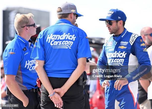 Chase Elliott, driver of the HendrickCars.com Chevrolet, speaks with crew members on the grid during practice for the NASCAR Xfinity Series Pocono...