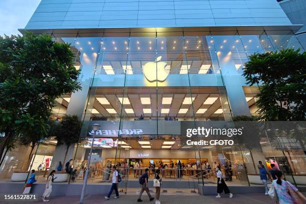 Hong Kong, CHINA - JULY 25, 2023 - Customers walk past the Apple Store in Causeway Bay in Hong Kong, China, July 25, 2023.