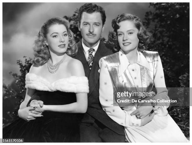 Publicity portrait of actors Eleanor Parker , Gig Young and Alexis Smith in the film 'The Woman in White' United States.