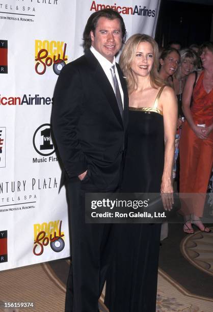 Actor John Travolt and actress Kelly Preston attend the Nancy Davis Foundation's Eighth Annual Race to Erase MS Gala on May 18, 2001 at the Century...