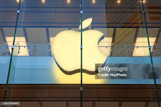 Customers walk past the Apple Store in Causeway Bay in Hong Kong, China, July 25, 2023.