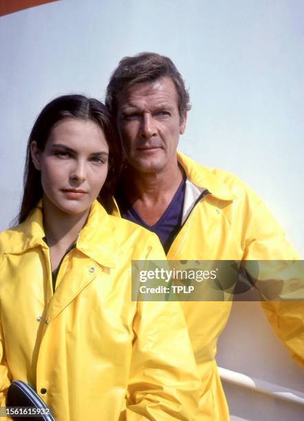 French actress Carole Bouquet, is Melina Havelock and English actor Roger Moore , is James Bond, pose for a portrait during the filming of the 1981...