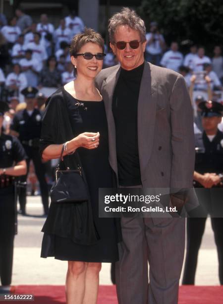 Actress Annette Bening and actor Warren Beatty attend Warren Beatty's hand and footprints in cement on May 21, 1998 at Mann's Chinese Theatre in...