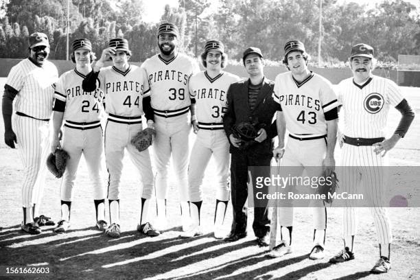 Professional baseball player Dave Parker of the Pittsburgh Pirates poses with the cast of a 7 Up commercial wearing uniforms of the Pittsburgh...
