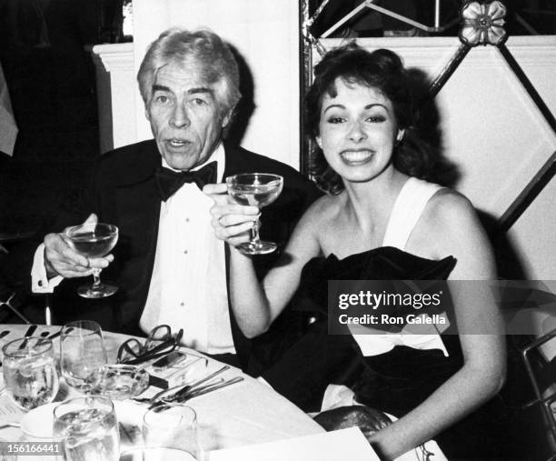 Actor James Coburn and date Lisa Alexander attending 'First Annual Operation California Benefit' on February 11, 1983 at the Beverly Hills Hotel in...