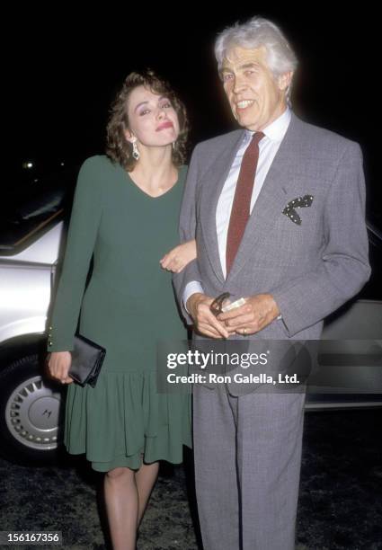 Actor James Coburn and his girlfriend Lisa Alexander on May 26, 1987 dining at Spago in West Hollywood, California.