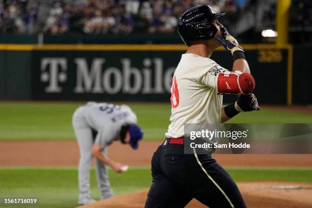 Nathaniel Lowe of the Texas Rangers runs the bases after hitting a two-run home run during the first inning against the Los Angeles Dodgers at Globe...