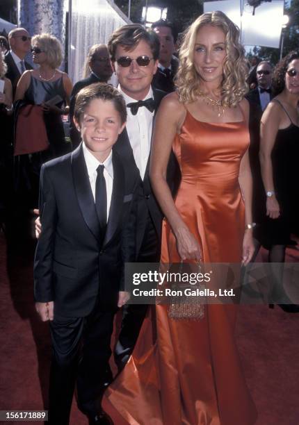 Actor Michael J. Fox, actress Tracy Pollan and son Sam Fox attend the 51st Annual Primetime Emmy Awards on September 12, 1999 at Shrine Auditorium in...