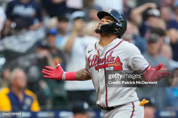 Orlando Arcia of the Atlanta Braves celebrates as he runs the bases after hitting a two-run home run against the Milwaukee Brewers in the second...