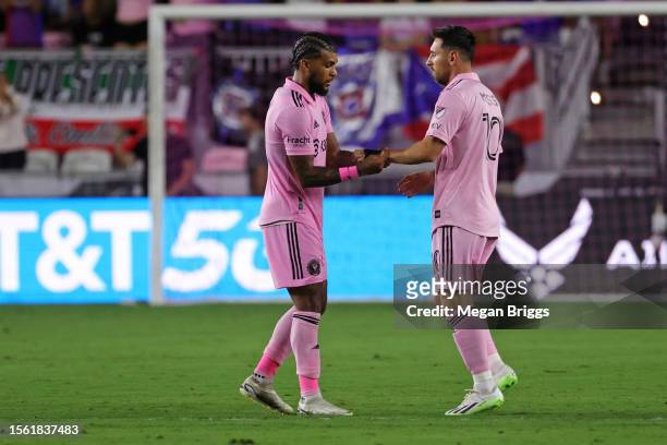 Lionel Messi of Inter Miami CF receives the captain band from DeAndre Yedlin after entering the match during the second half of the Leagues Cup 2023...