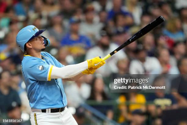Willy Adames of the Milwaukee Brewers hits a two-run home run against the Atlanta Braves in the sixth inning at American Family Field on July 21,...